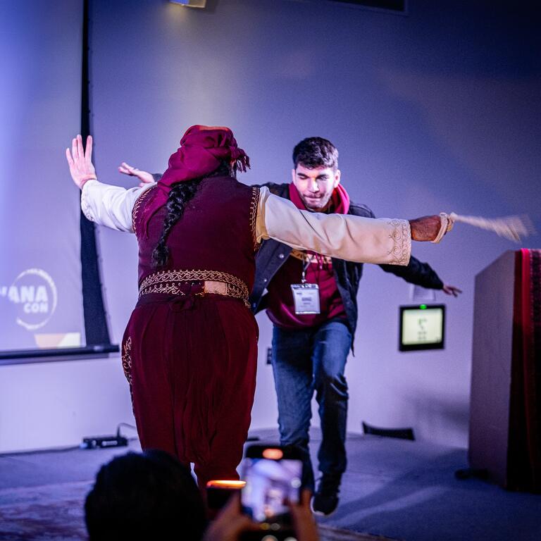 two people dancing on stage